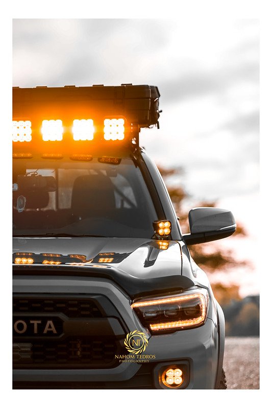 Toyota pickup with a roof LED light bar at sunset